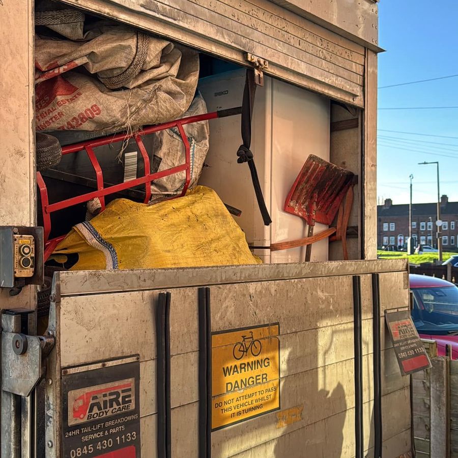 Luton van loaded with furniture, bags and appliances from a Birmingham clearance
