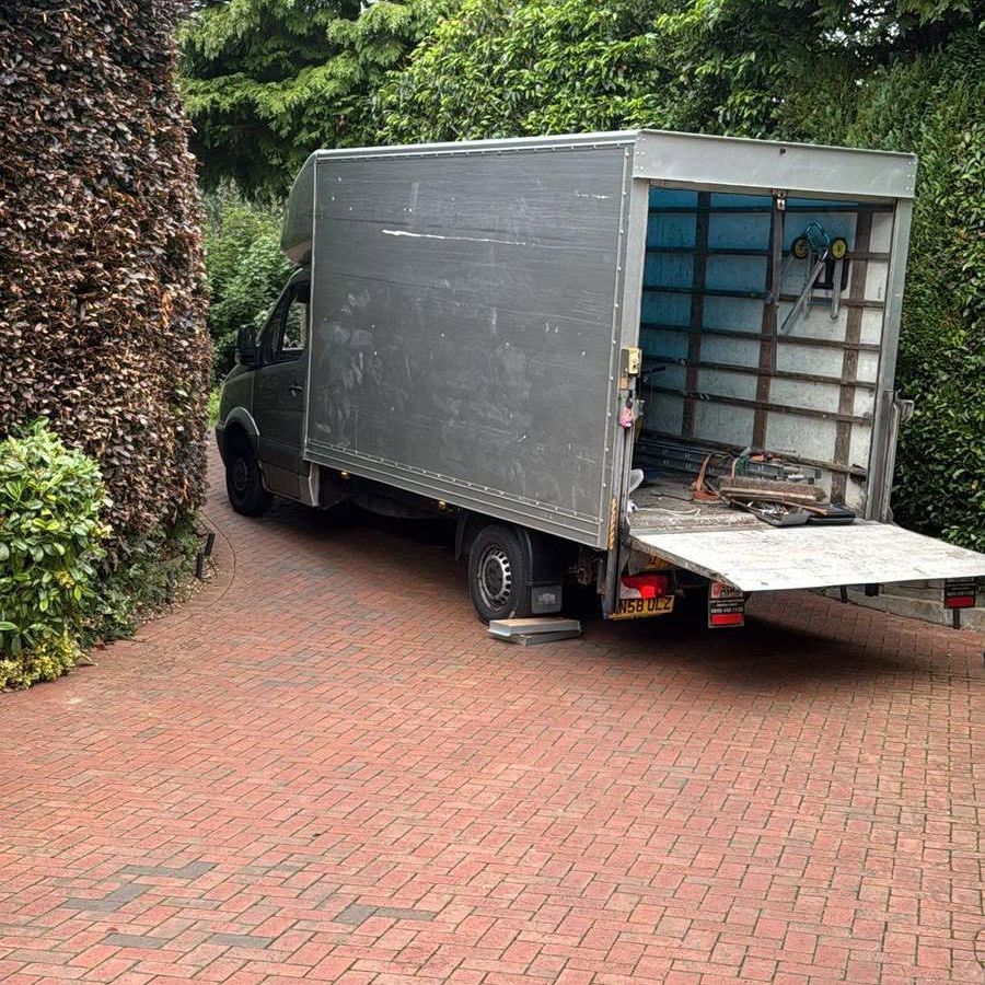Rubbish Monsters Removal Luton van with the tail lift down on a driveway